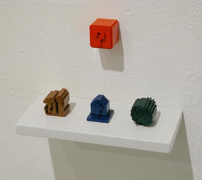 plastic 3d printed sculpture of super mario question block and zelda rock, tombstone, and bush from  nintendo