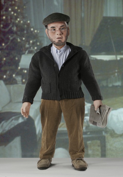 sculpture of doll in corporate america that has been digitally dressed up in a cardigan